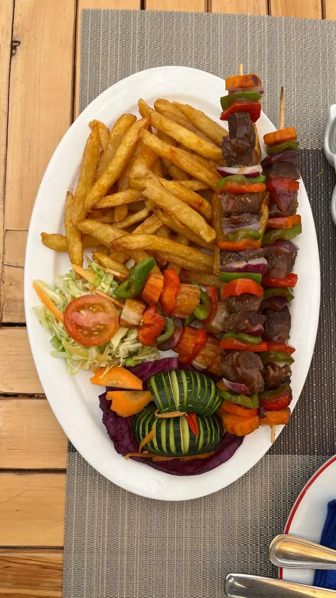 Beef skewers with chips served at Zamar Springs Gardens