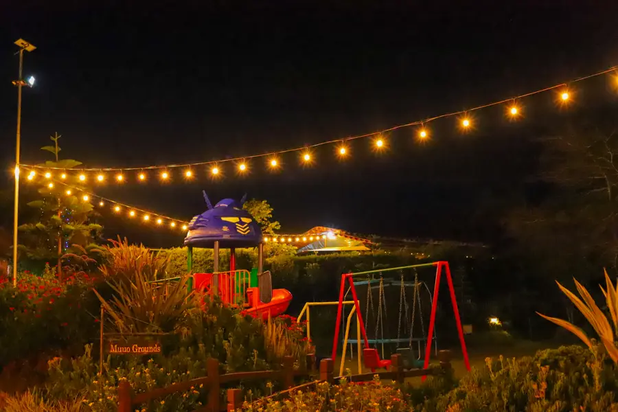 Muuo Garden night view with romantic lighting and kids play area at Zamar Springs