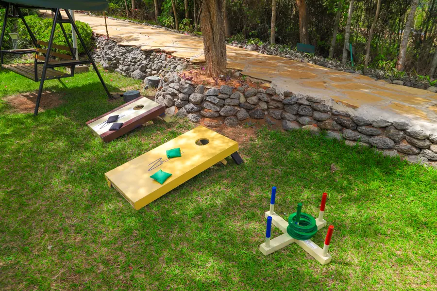 Kids playing cornhole and ring toss games on the lawn at Zamar Springs Gardens in Machakos. activity at Zamar Springs Gardens
