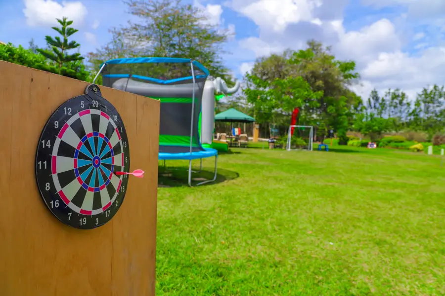 Children playing safe soft-tip darts at the Zamar Springs Gardens kids' zone in Machakos. activity at Zamar Springs Gardens