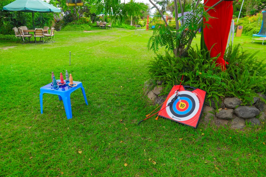 Children practicing soft archery with suction-cup arrows at Zamar Springs Gardens kids' play area in Machakos. activity at Zamar Springs Gardens