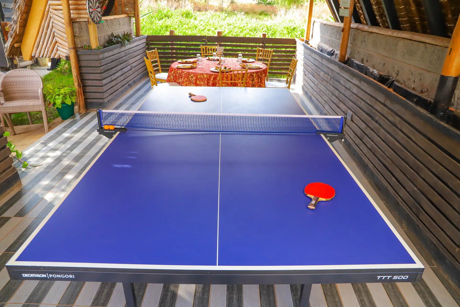 Adults enjoying table tennis at Zamar Springs Gardens